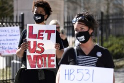 Protesters gather outside of the Georgia State Capitol to protest HB 531, which would place tougher restrictions on voting in Georgia, in Atlanta, Georgia, U.S.