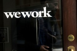 A man walks out of a WeWork space in the Manhattan borough of New York City, New York, U.S.,