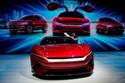 A man cleans a BYD e-SEED GT concept EV during the media day for the Shanghai auto show in Shanghai, China