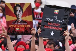 People hold placards as they gather to denounce the Myanmar military coup, in Taipei, Taiwan 