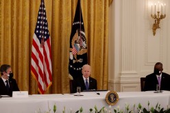 U.S. President Joe Biden is flanked by Secretary of State Antony Blinken and Defense Secretary Lloyd Austin as he holds a Cabinet meeting in the East Room