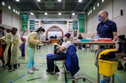 Nurses from Humber River Hospital's mobile vaccine clinic administer the Moderna COVID-19 vaccine at Toronto and Region Islamic Congregation Centre 