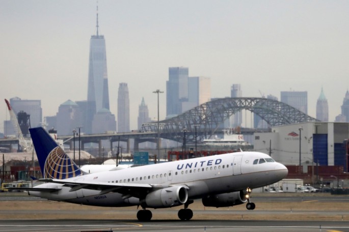 A United Airlines passenger jet takes off with New York City as a backdrop, at Newark Liberty International Airport, New Jersey, U.S.
