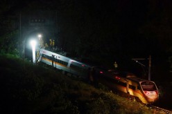 Rescuers work at the site after a train derailed in a tunnel north of Hualien, Taiwan