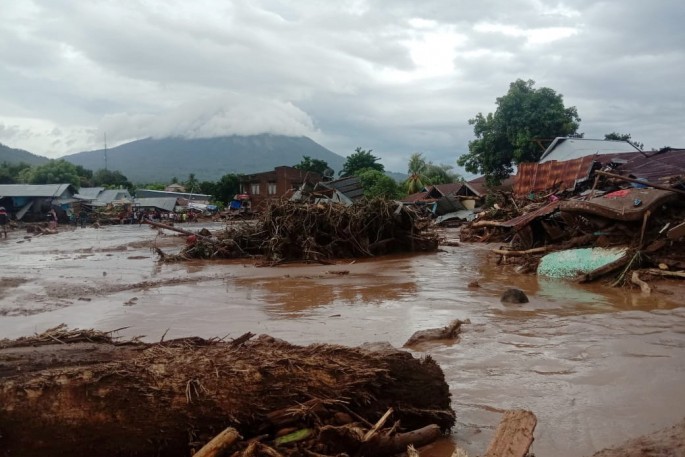 Damaged houses are seen at an area affected by flash floods after heavy rains in East Flores, East Nusa Tenggara province, 
