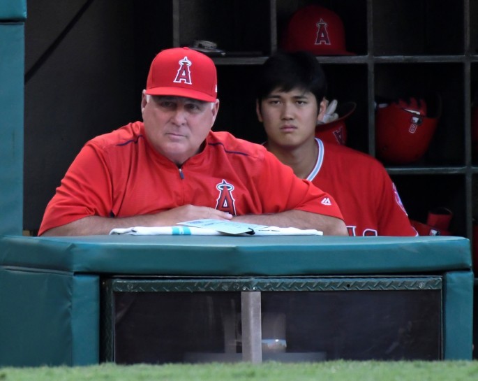 Jul 28, 2018; Anaheim, CA, USA; Los Angeles Angels manager Mike Scioscia (14) looks on from the dugout in the second inning during a game against the Seattle Mariners