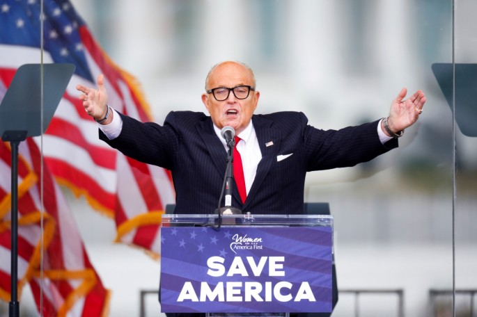 U.S. President Donald Trump's personal lawyer Rudy Giuliani gestures as he speaks as Trump supporters gather by the White House ahead of his speech to contest