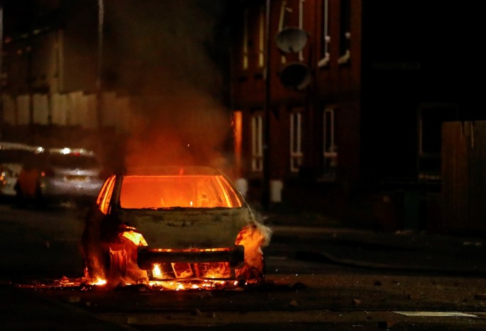 A burning car is pictured during a protest in the Loyalist Tigers Bay Area of Belfast, Northern Ireland