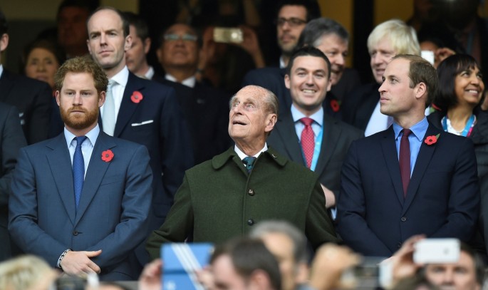 Britain's Prince Harry, Prince Philip and Prince William (L-R) attend the Rugby World Cup final match between New Zealand against Australia at Twickenham in London, 