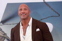 Cast member and producer Dwayne Johnson poses at the premiere for 