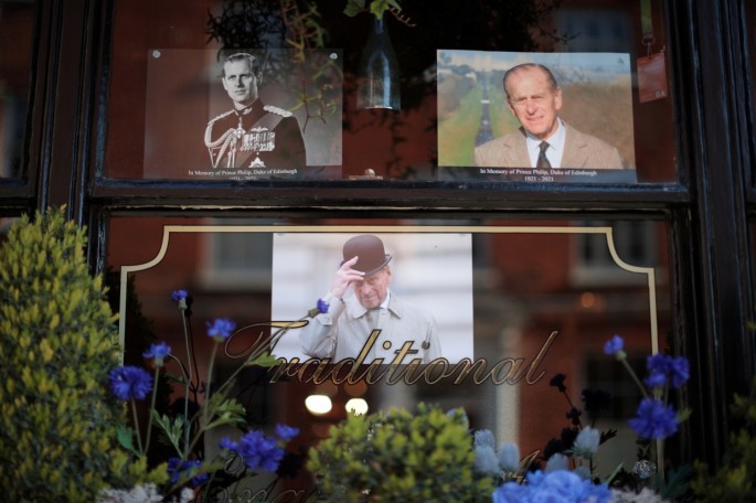 Pictures of Britain's Prince Philip, husband of Queen Elizabeth, are seen at a window in Windsor, near London, Britain,