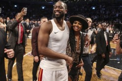 Apr 10, 2019; Brooklyn, NY, USA; Miami Heat guard Dwayne Wade (3) walks of the court with his Actress wife Gabrielle Union after his last NBA game against the Brooklyn Nets