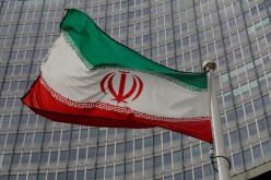  An Iranian flag flutters in front of the International Atomic Energy Agency (IAEA) headquarters in Vienna, Austria, 