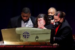 Katie Wright, the mother of Daunte Wright, a Black man who was fatally shot by a police officer after a routine traffic stop, reacts during his funeral at Shiloh Temple International Ministries