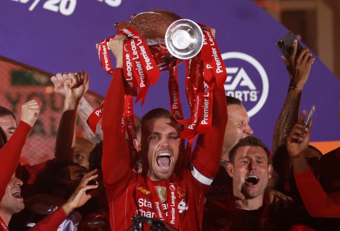 Soccer Football - Premier League - Liverpool v Chelsea - Anfield, Liverpool, Britain - July 22, 2020 Liverpool's Jordan Henderson with teammates celebrates 