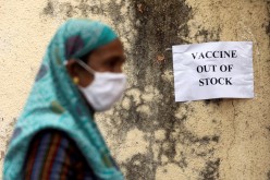 A notice about the shortage of coronavirus disease (COVID-19) vaccine supplies is seen at a vaccination centre, in Mumbai, India
