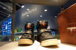 A pair of 'Nike Air Yeezy 1' prototype sneakers designed by Kanye West, are displayed at the Hong Kong Convention and Exhibition Centre before going up for private sale at Sotheby's, 