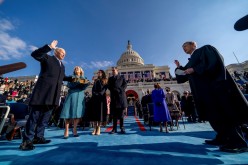Joe Biden is sworn in as the 46th president of the United States by Chief Justice John Roberts as Jill Biden holds the Bible during the 59th Presidential Inauguration 