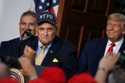 Former New York City Mayor Rudy Giuliani speaks alongside U.S. President Donald Trump during remarks to the City of New York Police Benevolent Association 