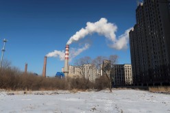 A coal-fired heating complex is seen behind the ground covered by snow in Harbin, Heilongjiang province, China 