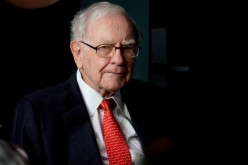 Warren Buffett, CEO of Berkshire Hathaway Inc, pauses while playing bridge as part of the company annual meeting weekend in Omaha, 