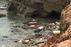 Debris lies in the water after a deadly boat incident, where a 40' cabin cruiser broke up along rocks at Point Loma, San Diego, California, U.S.