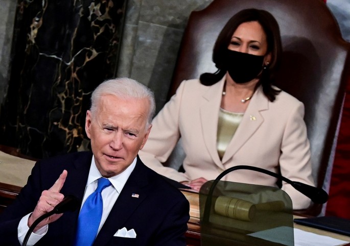 U.S. President Joe Biden addresses a joint session of Congress as U.S. Vice President Kamala Harris looks on at the U.S. Capitol in Washington, U.S