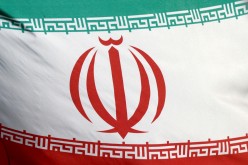 The Iranian flag waves in front of the International Atomic Energy Agency (IAEA) headquarters in Vienna, Austria