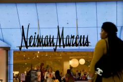 Shoppers enter and exit the Neiman Marcus at the King of Prussia Mall, United States' largest retail shopping space, in King of Prussia, Pennsylvania