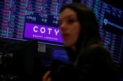 A screen displays the logo and trading information for Coty Inc at the New York Stock Exchange (NYSE) in New York, U.S.