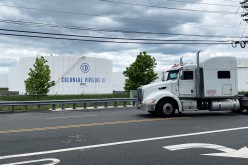 A truck passes holding tanks at Colonial Pipeline's Linden Junction Tank Farm in Woodbridge, New Jersey, U.S.,