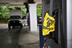 A bagged nozzle at a pump notifies motorists that it no longer has fuel after a cyberattack crippled the biggest fuel pipeline in the country,