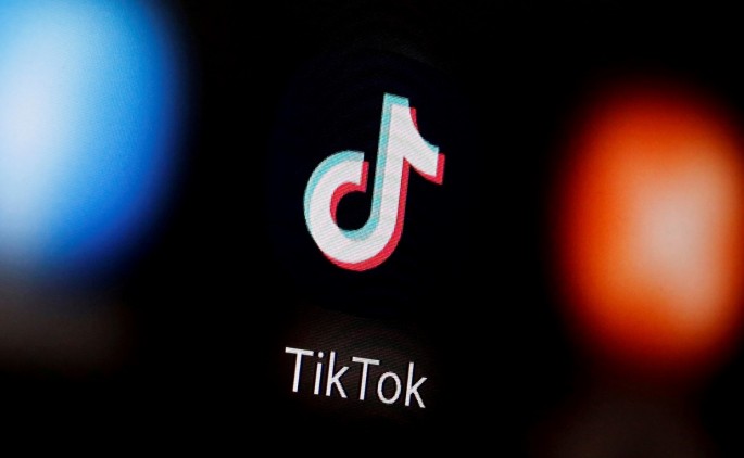 A TikTok logo is displayed on a smartphone in this illustration taken