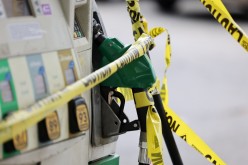 Gas pumps are roped off with a tape indicating a lack of gasoline at a gas station in Washington, U.S.,
