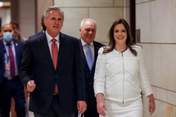 U.S. House Minority Leader Kevin McCarthy (R-CA) walks with U.S. Representative Elise Stefanik (R-NY) after the Republican caucus meeting to speak to the media, in Washington, U.S.