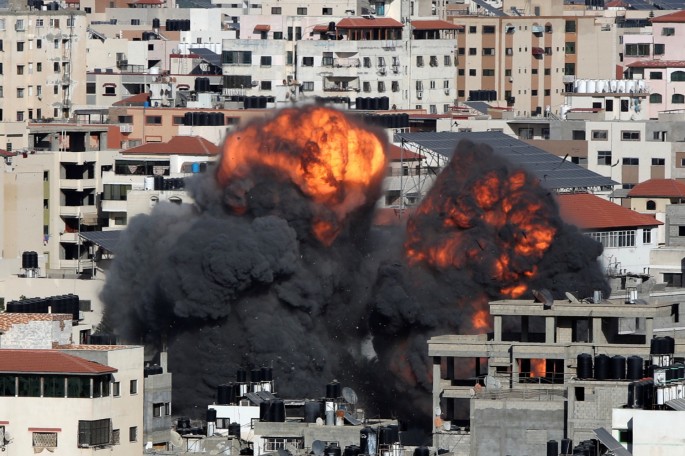 Smoke and flames rise during an Israeli air strike, amid a flare-up of Israeli-Palestinian violence, in Gaza City