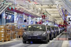 Tesla China-made Model 3 vehicles are seen during a delivery event at its factory in Shanghai, China
