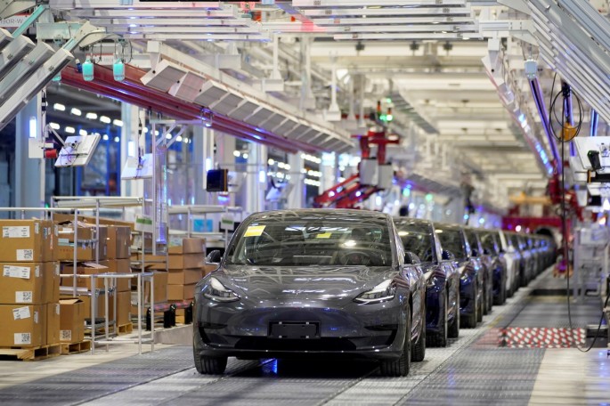 Tesla China-made Model 3 vehicles are seen during a delivery event at its factory in Shanghai, China