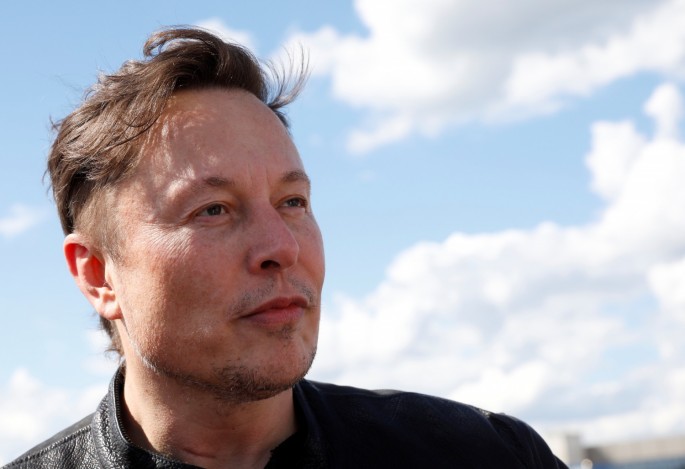 SpaceX founder and Tesla CEO Elon Musk looks on as he visits the construction site of Tesla's gigafactory in Gruenheide, near Berlin,