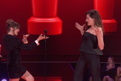 Elizabeth Olsen and Kathryn Hahn react while accepting the Best Fight award for WandaVision during the 2021 MTV Movie & TV Awards in Los Angeles, California, U.S