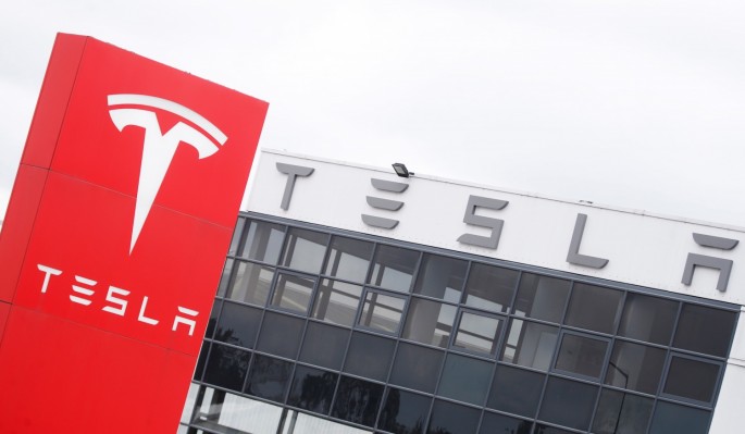 The logo of car manufacturer Tesla is seen at a dealership in London, Britain