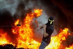 A Palestinian demonstrator takes part in an anti-Israel protest over a cross-border violence between Palestinian militants in Gaza 