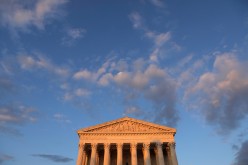 Light from the sunset shines on the United States Supreme Court Building in Washington, D.C., U.S.,