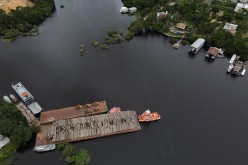 An aerial view shows wood logs on a raft at the Federal Police base in Manaus, Amazonas state, Brazil