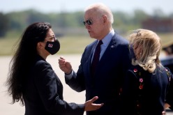 U.S. President Joe Biden is greeted by U.S. Rep. Debbie Dingell (D-MI) and U.S. Rep. Rashida Tlaib at Detroit Metropolitan Wayne County Airport,