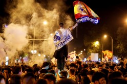 Soccer Football - Real Madrid fans watch the Champions League Final - Madrid, Spain - May 27, 2018 Real Madrid fans celebrate near the Cibeles fountain in central Madrid