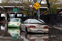 Parked cars are partially submerged in flood waters in the aftermath of Hurricane Sandy in New York