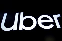 A screen displays the company logo for Uber Technologies Inc. on the day of it's IPO at the New York Stock Exchange (NYSE) in New York, U.S.