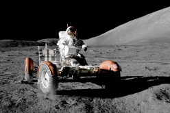 NASA astronaut Eugene A. Cernan makes a short checkout of the lunar rover during the early part of the first Apollo 17 extravehicular activity at the Taurus-Littrow landing site in this NASA handout picture