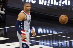 May 26, 2021; Philadelphia, Pennsylvania, USA; Washington Wizards guard Russell Westbrook (4) reacts after a dunk against the Philadelphia 76ers 